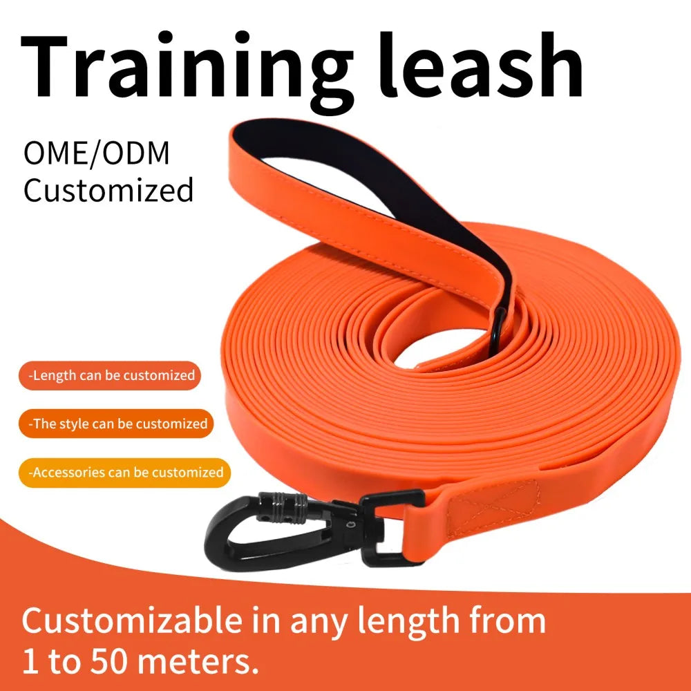 Orange training leash coiled and ready for customization, featuring a padded handle and adjustable length.