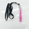 A pink ultrasonic dog whistle attached to a black lanyard and clip.