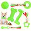 A set of green durable chew toys for puppies, including a ball, bone, and ring shapes.