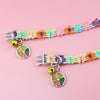 A colorful lace pet collar with a floral pattern and a gold pendant for small dogs and cats.