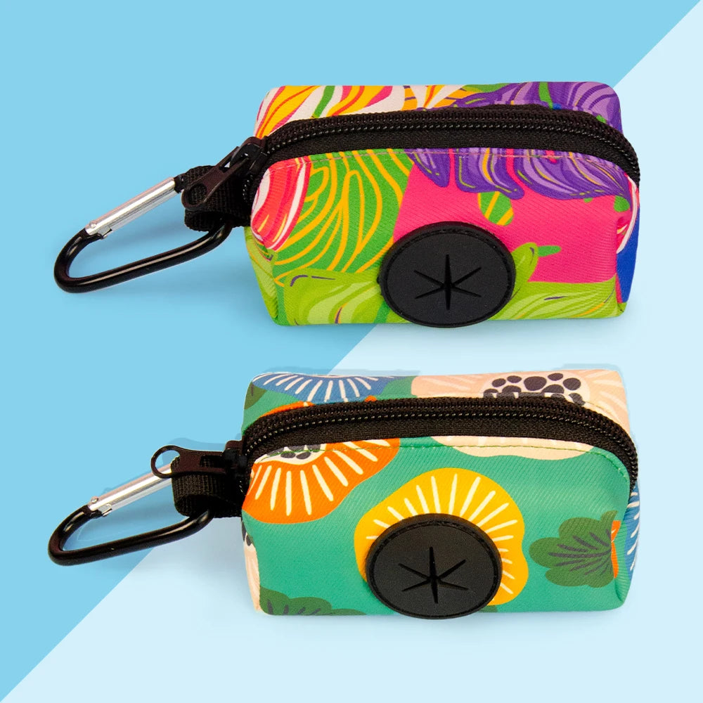 A vibrant pink and green stylish dog poop bag holder with a black strap and clip.