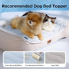 A fluffy apricot dog is resting on a beige pet bed topper with soft wave quilting and a non-slip surface.