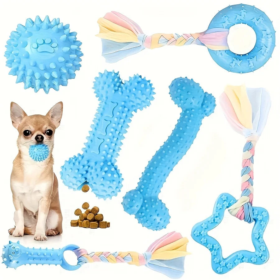 A set of blue and pink durable chew toys for puppies, including a ball, bone, and ring.