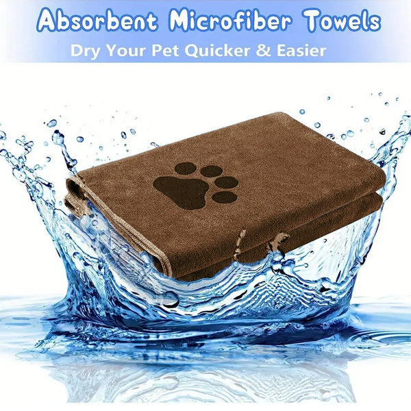A brown absorbent microfiber pet towel with an embroidered paw print being splashed by water.