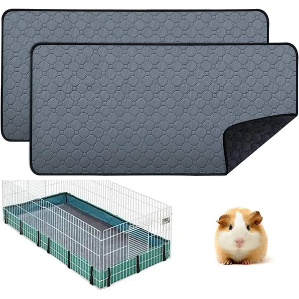 Gray reusable non-slip fleece cage liner with a hexagonal pattern and a clear wire enclosure for small pets