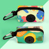 A colorful, patterned fabric poop bag holder with a black strap and clip.