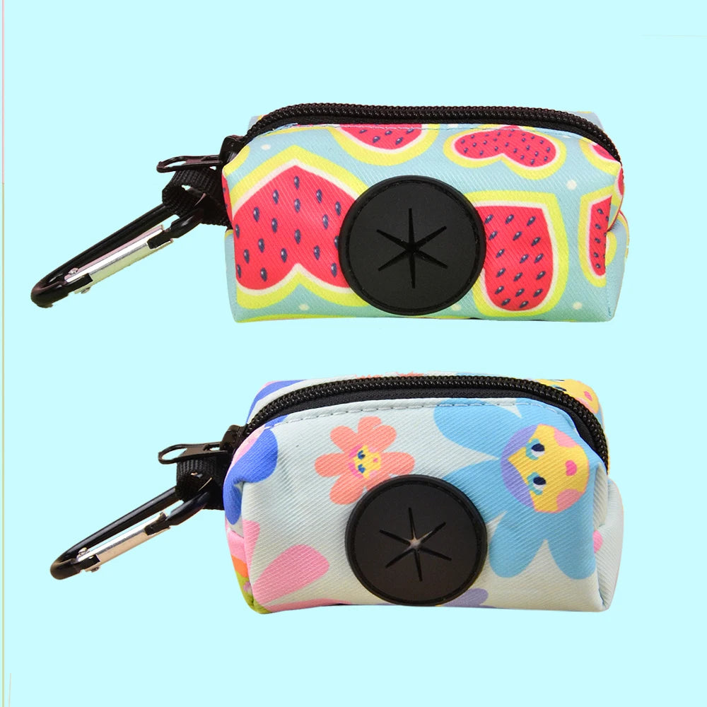 A colorful, patterned pouch designed to hold dog poop, featuring a black clasp and a circular opening.