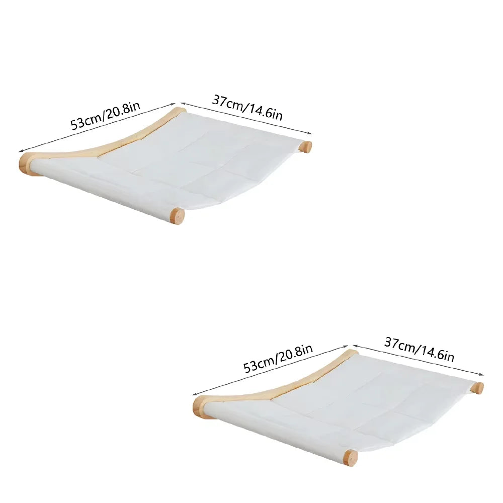 A white wall mounted cat hammock and climbing shelf set with wooden supports.