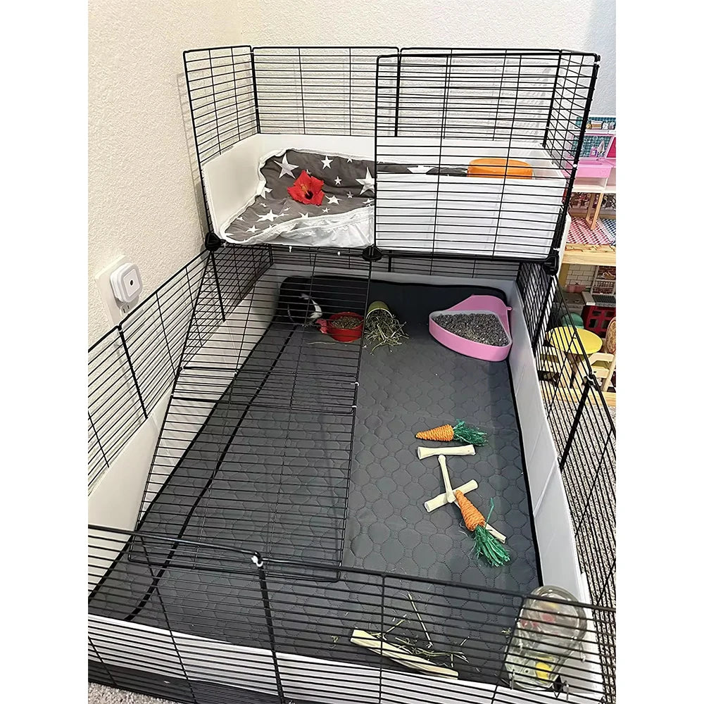 A black wire cage liner with a white base and a removable fleece mat for small pets.
