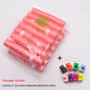 A package containing 14 rolls of pink paw print dog waste bags and one randomly colored bone dispenser.