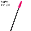 A single pink iron wire eyelash brush with a black handle.