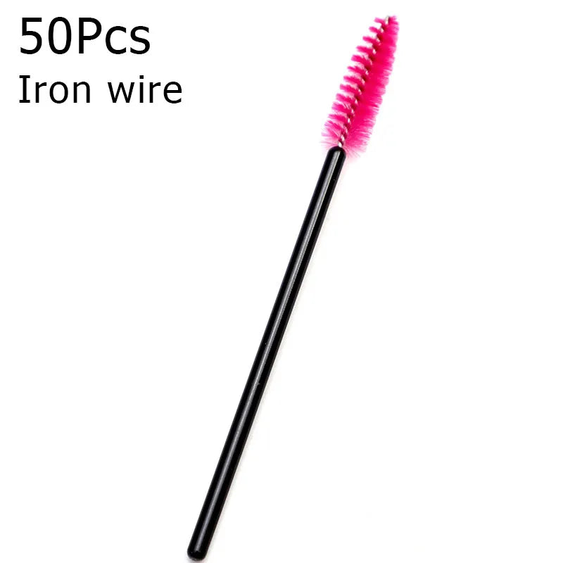 A single pink iron wire eyelash brush with a black handle.