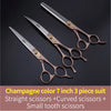 A set of three champagne color grooming scissors including straight, curved, and small tooth scissors