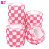 Rolls of pink and white checkered printed self-adhesive elastic bandage tape