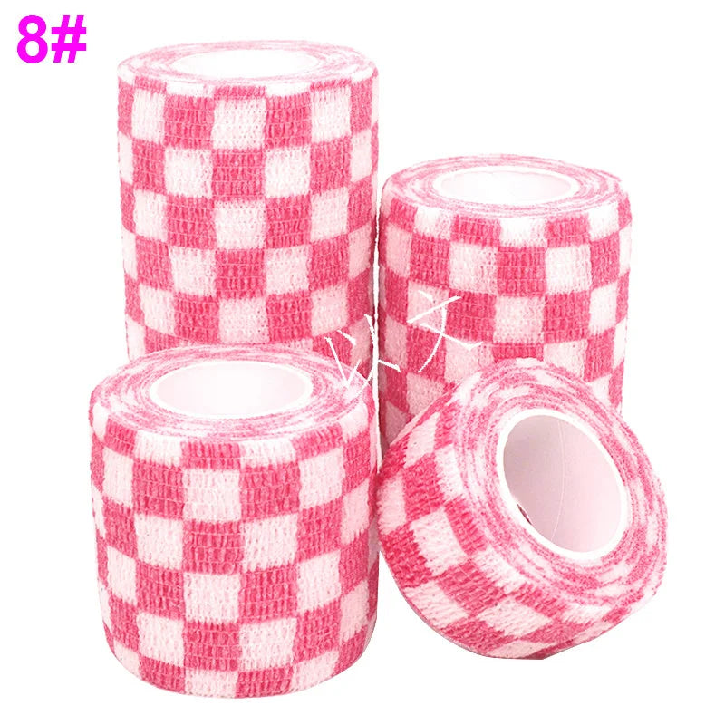 Rolls of pink and white checkered printed self-adhesive elastic bandage tape