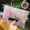 A clear plastic bag filled with colorful elastic hair bands shaped like a duck and waves.