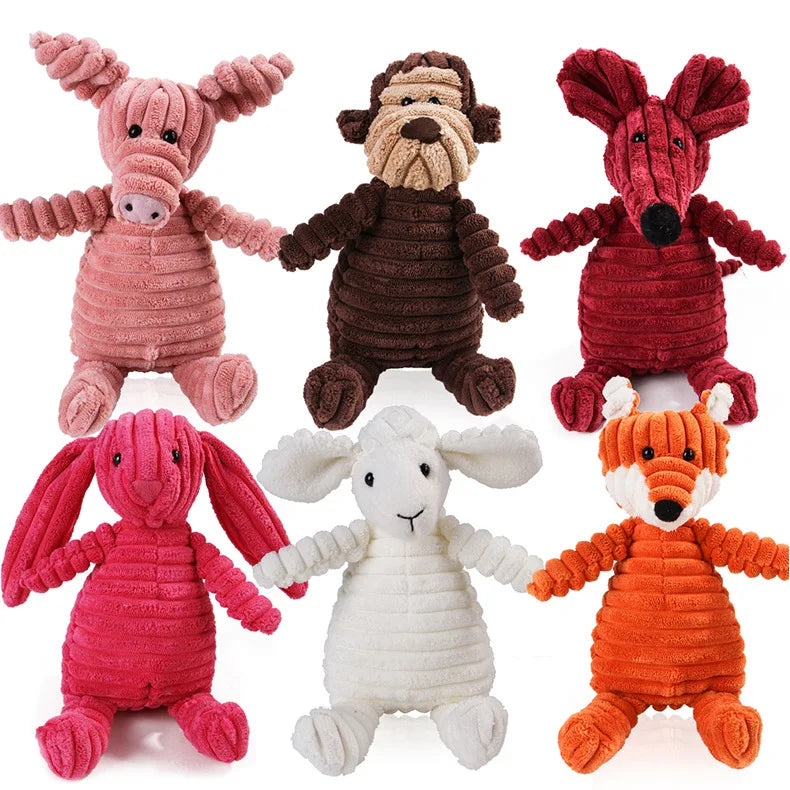 Colección de ocho juguetes masticables para perros de molar de peluche en varios colores como rosa, marrón, rojo y naranja.