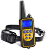 A black remote control electric dog training collar with a yellow display and strap.