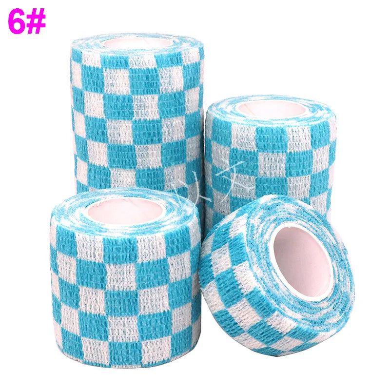 Rolls of blue and white checkered printed self-adhesive elastic bandage tape