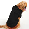 A golden retriever wearing a black fleece dog coat and hoodie.