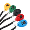 Five colored pet training clickers with black wrist straps are displayed against a white background.