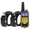 A black remote control electric dog training collar with a yellow display and buttons.