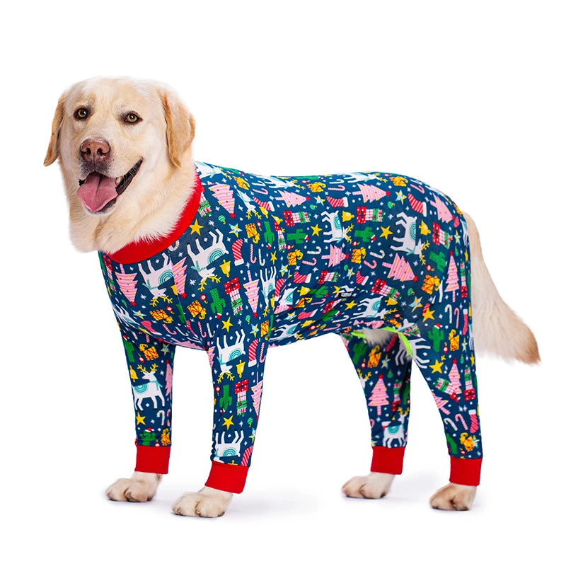 A golden retriever wearing a blue and green cartoon print cotton pajama suit.