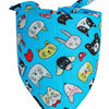 A blue fabric bandana with a pattern of cute animal faces for dogs and cats
