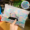 A clear plastic pouch filled with colorful elastic hair bands and a graphic of a duck saying I can't swim.
