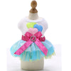 A pink and blue elegant spring pet dress for dogs featuring a white top and a ruffled skirt.