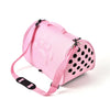Pink breathable pet carrier bag for cats and small dogs with paw print design