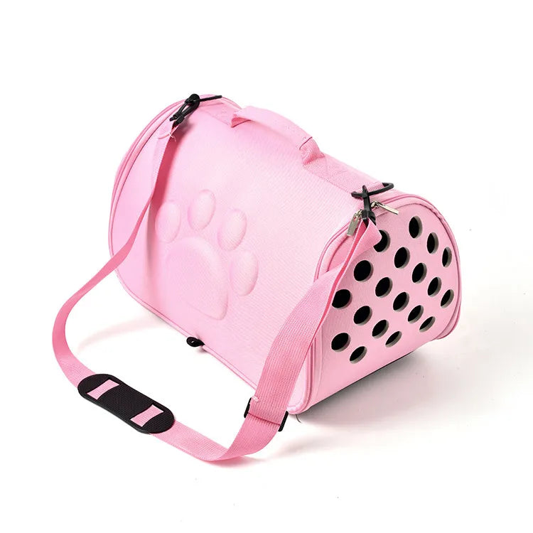 Pink breathable pet carrier bag for cats and small dogs with paw print design