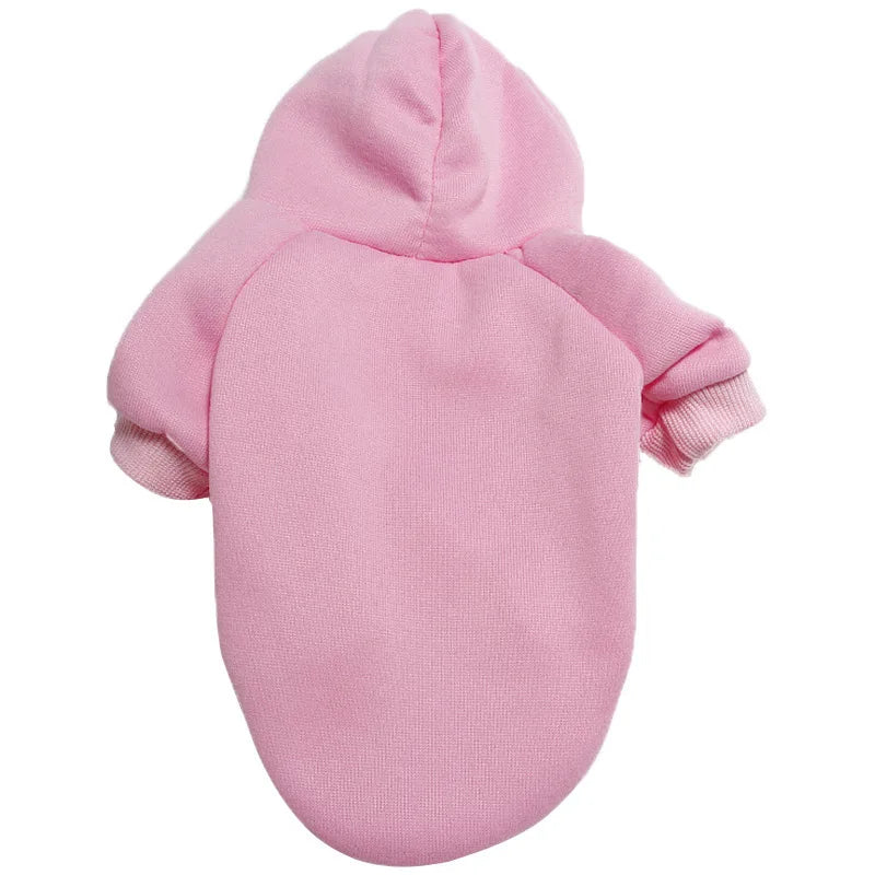 A pink premium fleece dog coat and hoodie for a pet.