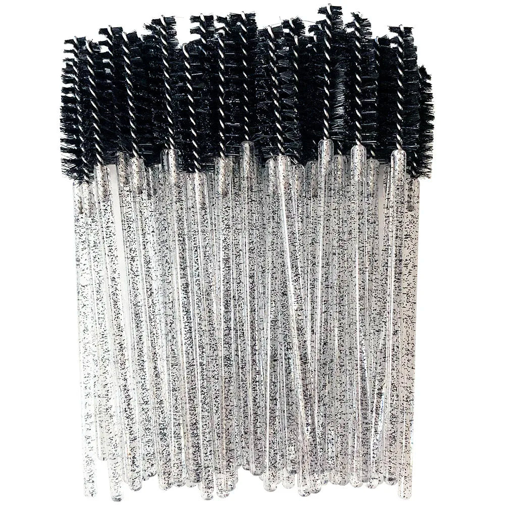A bundle of disposable eyelash brushes with black and silver bristles.