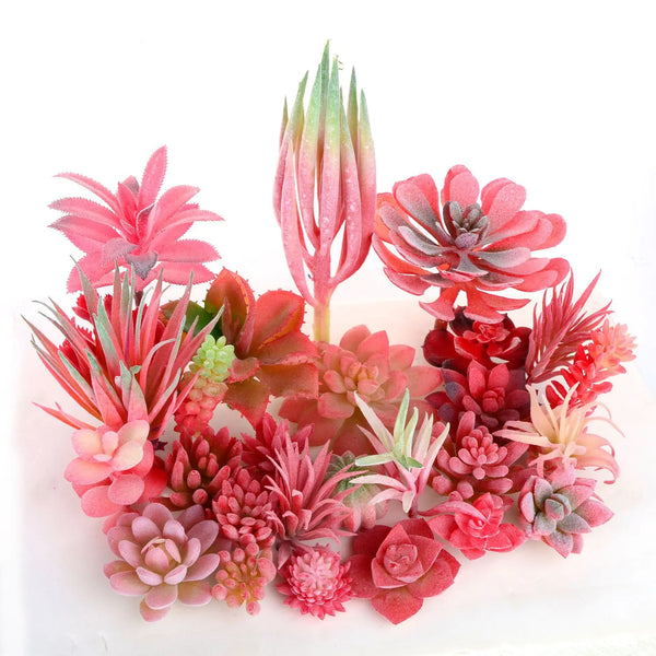 A cluster of artificial mini bonsai succulents in shades of red and pink, featuring various textures and growth stages.