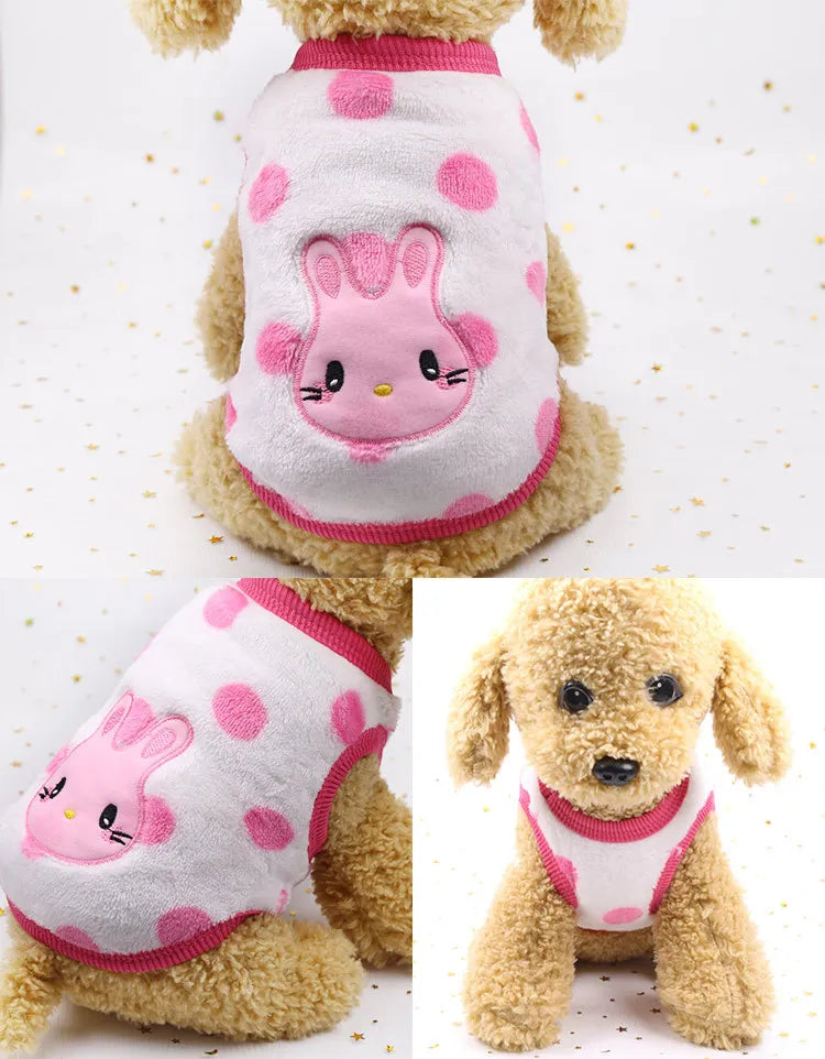 A pink and white fleece puffer vest for a small dog, featuring a cute face design.