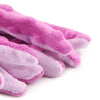 A close-up of several pink and lavender plush sea turtle dog toys.