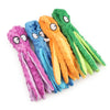 A collection of colorful, plush sea turtle toys in purple, blue, orange, and green.