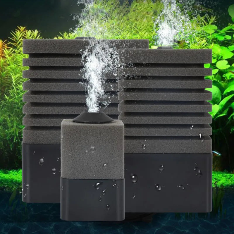 A black aquarium bio sponge filter unit with an air pump connection is shown against a green, natural background.