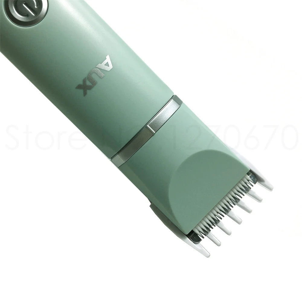 A teal pet grooming trimmer with a silver guard is shown diagonally.