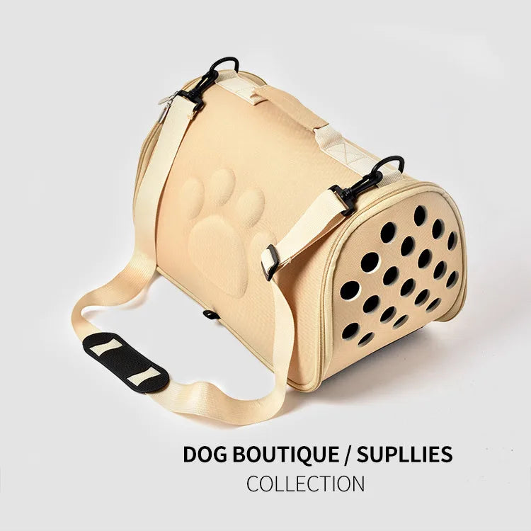 A beige breathable pet carrier bag for cats and small dogs with a padded handle.