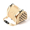 A beige breathable pet carrier bag for cats and small dogs with a padded body and mesh ventilation.