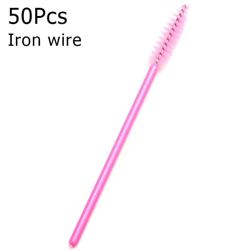 A pink iron wire eyelash brush with a fine, bristled tip.