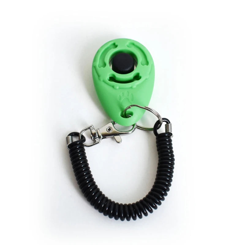 A bright green pet training clicker with a black button and a metal wrist strap attached.