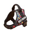 A black and pink patterned adjustable pet walking harness for dogs.