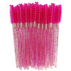 A bundle of bright pink disposable eyelash brushes with glittery pink stems.