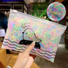 A clear plastic bag filled with colorful elastic hair bands shaped like ducks and swimming lines.