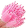 A cluster of pink disposable eyelash brushes used for makeup application.
