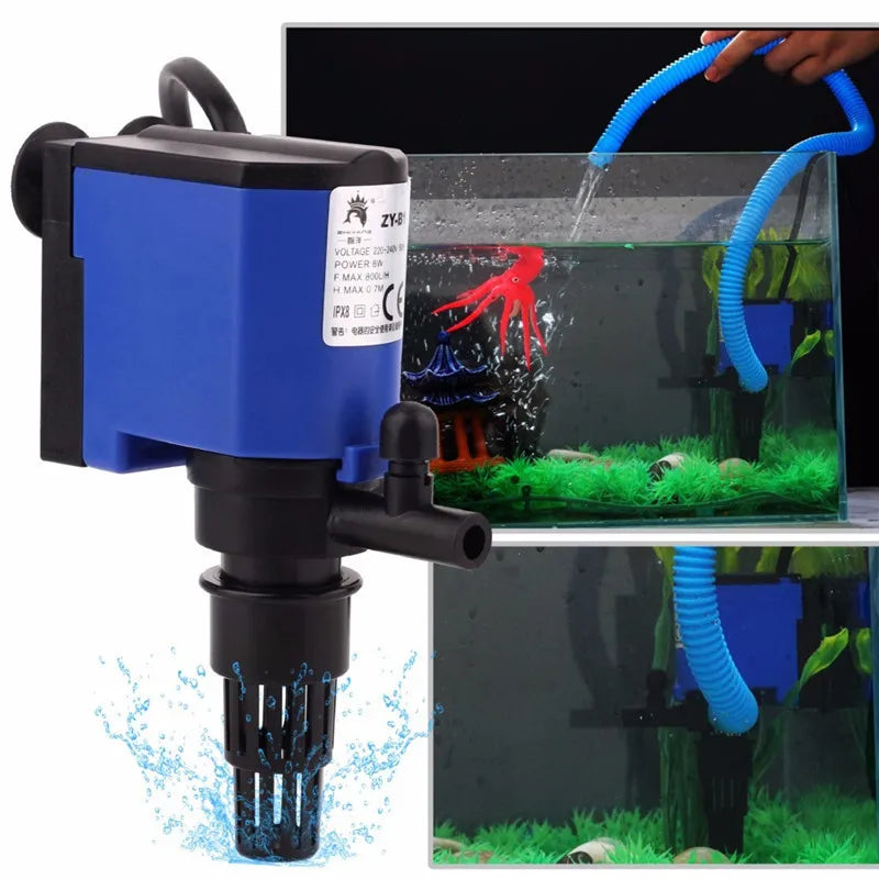 A black submersible aquarium filter pump is shown with a blue hose spraying water into an aquarium setup.