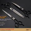 A set of black Japanese pet grooming scissors including a straight shear, bending shear, and large tooth scissors.